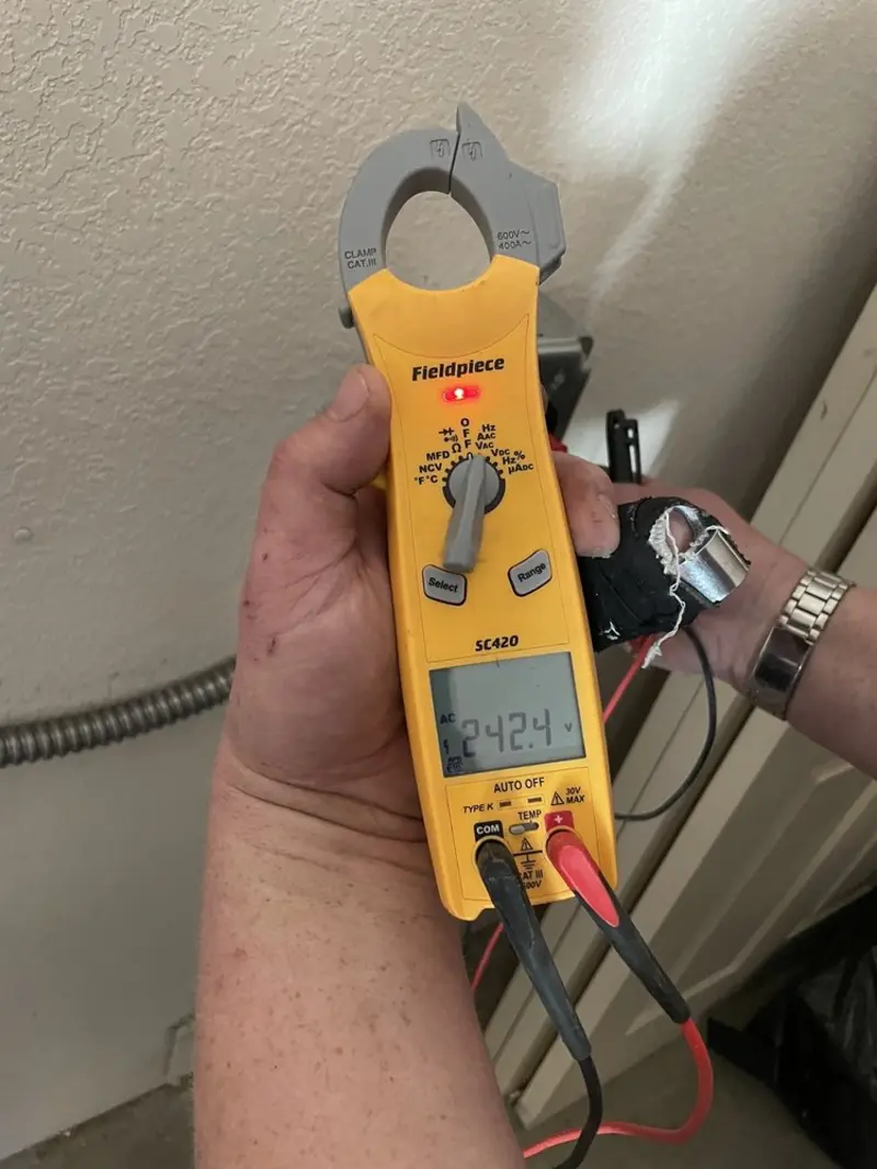 Voltage testing with clamp meter during Generator Installation in Bon Secour